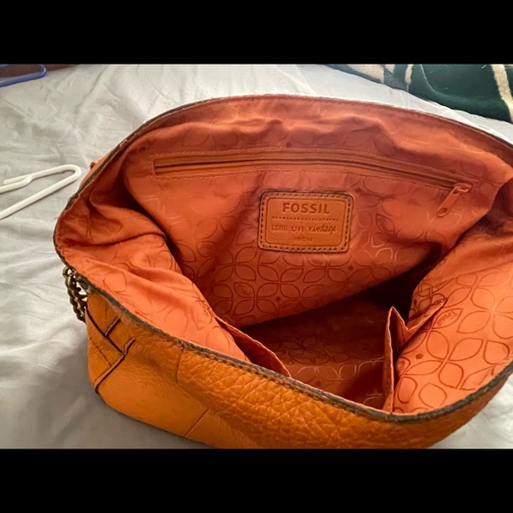 Fossil Handbags - Leather brief case bag chain on the handle has some stain nice color good deal .
